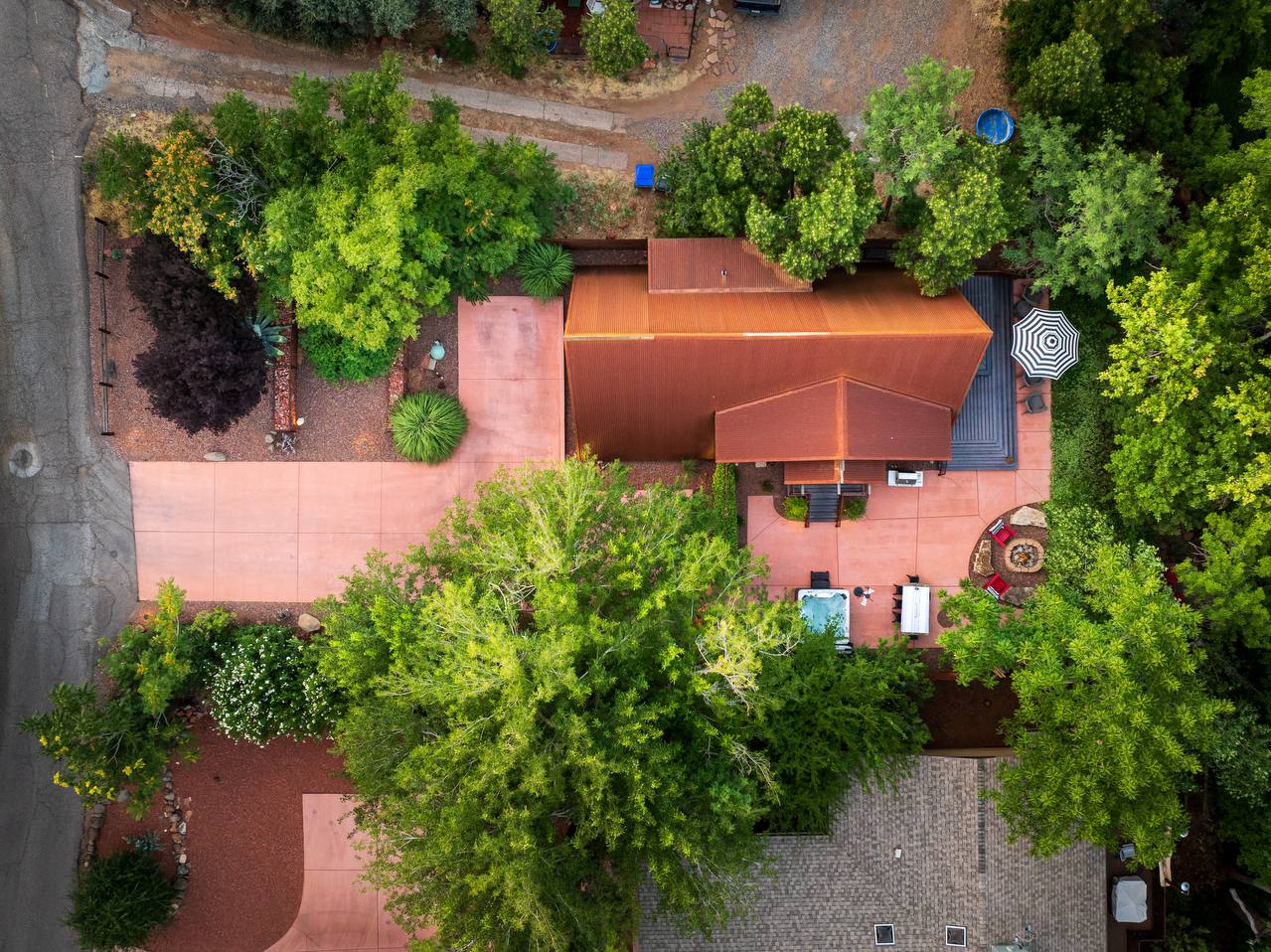 Top-down aerial of Creekside 88 with green tree canopy — summer