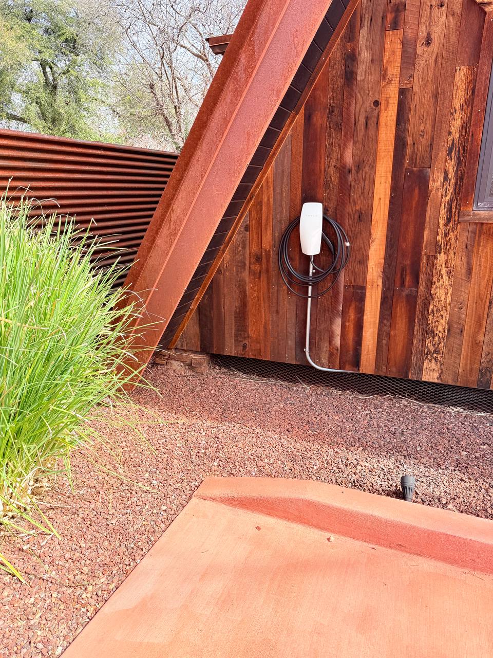 Tesla EV charger outside the cabin